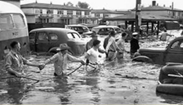 Flood incedent people holding hands